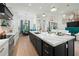 Open kitchen with modern island and high-end finishes at 3015 Avenue E, Holmes Beach, FL 34217