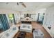Open concept kitchen and living area with island and hardwood floors at 3015 Avenue E, Holmes Beach, FL 34217