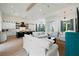 Open concept kitchen with white cabinets, large island, and high-end appliances at 3015 Avenue E, Holmes Beach, FL 34217