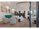 Open concept living area with hardwood floors and natural light at 3015 Avenue E, Holmes Beach, FL 34217