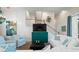 Bright living room features stylish seating, built-in media cabinet, and a view of the staircase at 3015 Avenue E, Holmes Beach, FL 34217