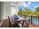 Spacious pool deck with outdoor dining set and lush tropical landscaping at 3015 Avenue E, Holmes Beach, FL 34217