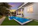 Long rectangular pool with surrounding landscaping and home visible at 3015 Avenue E, Holmes Beach, FL 34217
