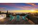 Enjoy sunset views from this rooftop deck with three chairs at 3015 Avenue E, Holmes Beach, FL 34217