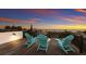 Spacious rooftop deck with ocean views and Adirondack chairs at 3015 Avenue E, Holmes Beach, FL 34217