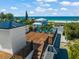 Relaxing rooftop deck with ocean views and teal chairs at 3015 Avenue E, Holmes Beach, FL 34217