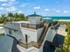 Spacious rooftop deck with ocean views and seating at 3015 Avenue E, Holmes Beach, FL 34217