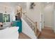 Modern staircase with white risers and wooden handrail at 3015 Avenue E, Holmes Beach, FL 34217