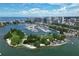 Scenic aerial view of a marina, city skyline, and waterfront park at 3102 Windrush Bourne # 4, Sarasota, FL 34235