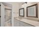Well-lit bathroom with a spacious vanity, modern fixtures, and a walk-in shower at 3102 Windrush Bourne # 4, Sarasota, FL 34235