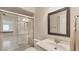 Clean bathroom featuring a glass-enclosed shower, updated fixtures, and a bright vanity at 3102 Windrush Bourne # 4, Sarasota, FL 34235