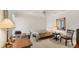 Comfortable bedroom with ceiling fan, desk, and ample natural light at 3102 Windrush Bourne # 4, Sarasota, FL 34235