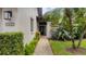 Charming home exterior with tropical landscaping and a welcoming walkway at 3102 Windrush Bourne # 4, Sarasota, FL 34235