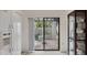 Cozy patio view through sliding glass door, perfect for outdoor relaxation at 3102 Windrush Bourne # 4, Sarasota, FL 34235