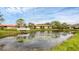 Scenic view of a pond reflecting nearby buildings and a picturesque bridge at 3102 Windrush Bourne # 4, Sarasota, FL 34235