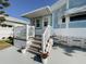 Inviting front porch with white railing and potted plants at 3333 26Th E Ave # 1116, Bradenton, FL 34208