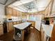 Bright kitchen with light wood cabinets and a kitchen island at 3333 26Th E Ave # 1116, Bradenton, FL 34208