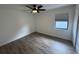 Bright bedroom featuring gray vinyl plank flooring and ceiling fan at 3517 Bahia Vista St, Sarasota, FL 34239