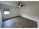 Spacious bedroom with gray vinyl plank flooring and ceiling fan at 3517 Bahia Vista St, Sarasota, FL 34239