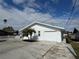White single-story house with attached garage and driveway at 3517 Bahia Vista St, Sarasota, FL 34239