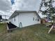 Side view of a white single story home with a small yard at 3517 Bahia Vista St, Sarasota, FL 34239