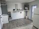 Laundry area with new flooring and space for a refrigerator at 3517 Bahia Vista St, Sarasota, FL 34239