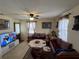 Living room with comfortable seating and a large TV at 3517 Bahia Vista St, Sarasota, FL 34239