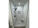Updated shower with white subway tile, built-in seat, and rainfall shower head at 3517 Bahia Vista St, Sarasota, FL 34239