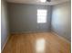 Bright bedroom with wood-look floors and a window at 3743 59Th W Ave # 3743, Bradenton, FL 34210