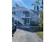 Light blue two-story building with white stairs and screened balconies at 3743 59Th W Ave # 3743, Bradenton, FL 34210