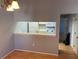 Open kitchen with white appliances and a breakfast bar at 3743 59Th W Ave # 3743, Bradenton, FL 34210