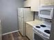 Well-equipped kitchen, featuring white appliances at 3743 59Th W Ave # 3743, Bradenton, FL 34210