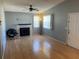 Bright living room featuring a fireplace and wood-look floors at 3743 59Th W Ave # 3743, Bradenton, FL 34210