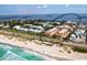 Aerial view of condo complex near beach and bay at 3810 Gulf Of Mexico Dr # F402, Longboat Key, FL 34228