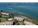 Aerial view of waterfront property with community pool and boat docks at 3860 Mariners Way # 413, Cortez, FL 34215