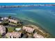 Aerial view of waterfront community with resort-style pool and boat slips at 3860 Mariners Way # 413, Cortez, FL 34215