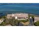 Aerial view of waterfront condo building with parking and waterfront access at 3860 Mariners Way # 413, Cortez, FL 34215