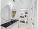 Bathroom with dual vanities and a walk-in shower at 3860 Mariners Way # 413, Cortez, FL 34215