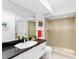 Clean bathroom with a walk-in shower and modern vanity at 3860 Mariners Way # 413, Cortez, FL 34215