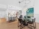 Bright dining area with glass table and modern light fixture at 3860 Mariners Way # 413, Cortez, FL 34215