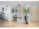 Light and airy entryway with wood floors and stylish decor at 3860 Mariners Way # 413, Cortez, FL 34215
