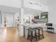 Modern kitchen with island, breakfast bar, and stainless steel appliances at 3860 Mariners Way # 413, Cortez, FL 34215