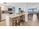 Modern kitchen with island, stainless steel appliances, and hardwood floors at 3860 Mariners Way # 413, Cortez, FL 34215