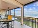 Spacious lanai with water views and outdoor furniture at 3860 Mariners Way # 413, Cortez, FL 34215