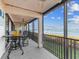 Screened lanai with water views and outdoor seating at 3860 Mariners Way # 413, Cortez, FL 34215