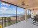 Relaxing lanai overlooking the water with outdoor seating at 3860 Mariners Way # 413, Cortez, FL 34215