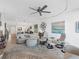 Spacious living room featuring comfortable seating and large artwork at 3860 Mariners Way # 413, Cortez, FL 34215
