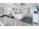 Bright main bedroom with a king-size bed and en-suite bathroom at 3860 Mariners Way # 413, Cortez, FL 34215