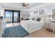 Main bedroom with water view and en-suite bathroom at 3860 Mariners Way # 413, Cortez, FL 34215