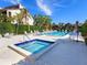 Community pool and spa with lounge chairs at 3860 Mariners Way # 413, Cortez, FL 34215